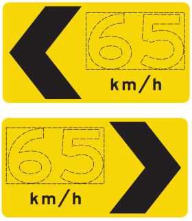 Two yellow D4-7 Curve Alignment Marker signs display a left and right arrow with “65 km/h” shown, advising the speed for the curve ahead.