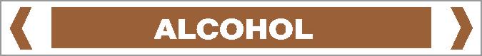 A brown rectangular sign labeled "ALCOHOL" in white capital letters from the Pipe Marker - OILS - ALCOHOL line features white angled brackets on each side.