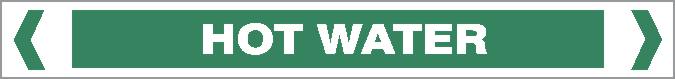 A green rectangular Pipe Marker - WATER- HOT WATER sign with white text in the center reading "HOT WATER," bordered by inward-pointing white arrows on both sides.