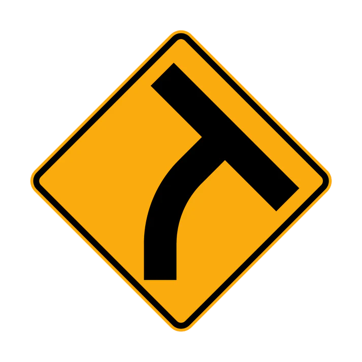 The W2-14(R) T-Intersection beyond a Curve (Right Symbolic) sign is a yellow diamond with a black symbol, warning of a T-intersection ahead where the road curves left and another road joins from the right.
