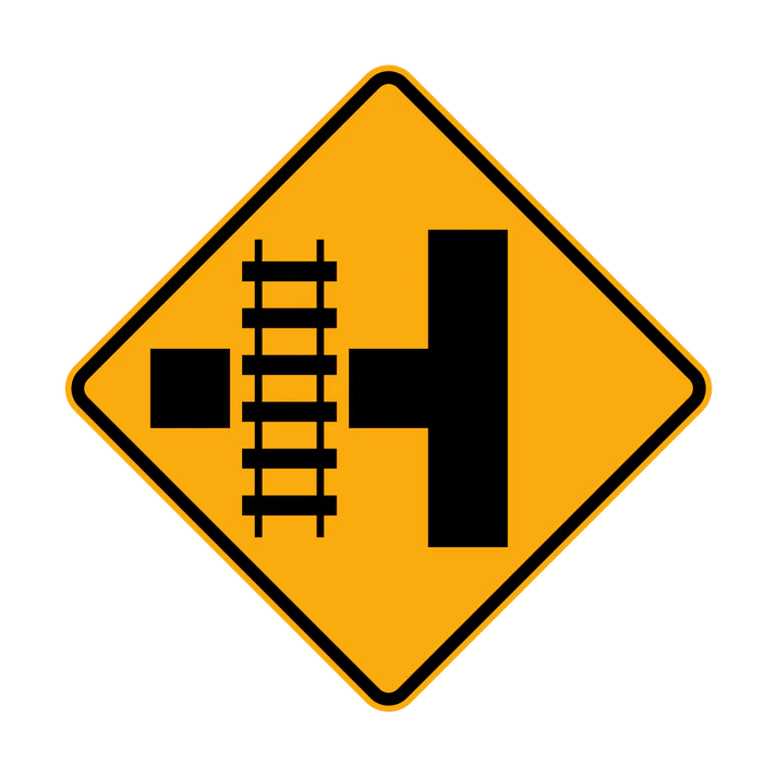 The W7-12(L) sign is a yellow diamond featuring a black diagram of a side road intersecting with railway tracks, warning drivers of a railway crossing ahead on the left side road.