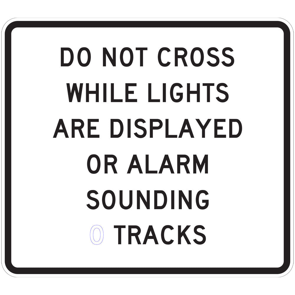 A rectangular W7-14-6 sign reads "DO NOT CROSS WHILE LIGHTS ARE DISPLAYED OR ALARM SOUNDING (2 TRACKS)" in bold, black uppercase letters on a white background with a black border.