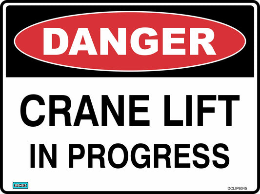 The Danger Crane Lift In Progress sign is rectangular, with a red "DANGER" oval and black "CRANE LIFT IN PROGRESS" text on white, alerting workers to hazardous conditions.