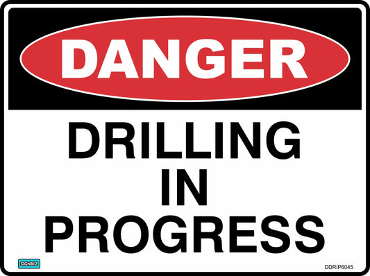 The "Danger Drilling In Progress" sign features a red oval labeled "DANGER" and bold black text below on a white background, serving as a safety sign to warn of drilling hazards in active work areas.
