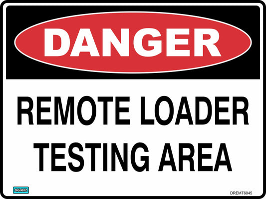 A "Danger Remote Loader Test Area" sign features a red oval labeled "DANGER" above bold black letters on a white background, warning of the remote loader test area.