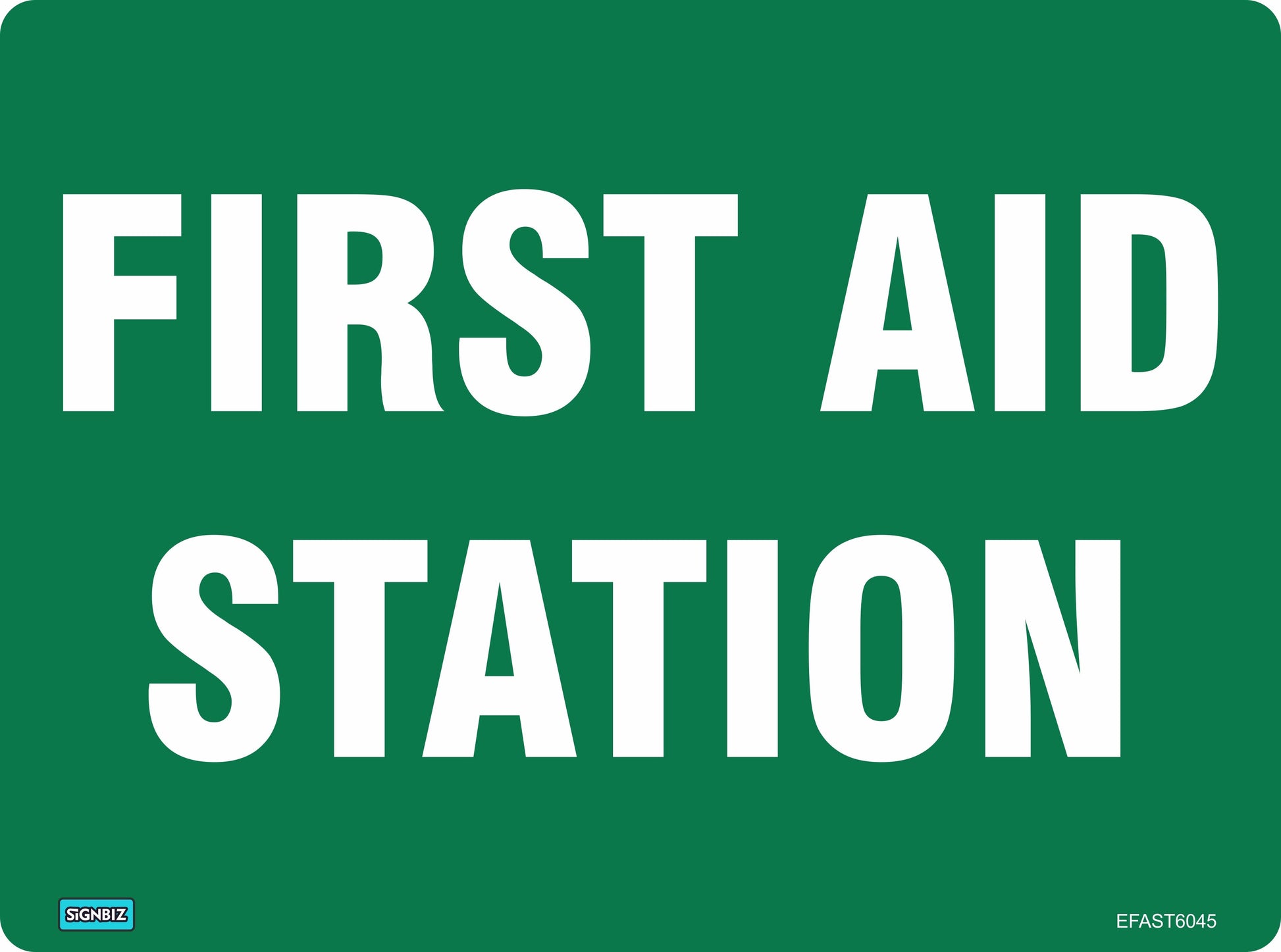 A green Emergency First Aid Station sign features large, all-capital white text reading "FIRST AID STATION," rounded corners, and a small label in the bottom left indicating the location of first aid facilities.