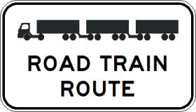 The G6-255n - Road Train Route (symbolic) sign is rectangular, showing a truck with two trailers above "ROAD TRAIN ROUTE" in bold black letters on a white background.