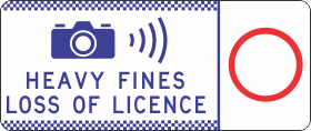 The G6-329n sign displays a camera and radar icon, “HEAVY FINES LOSS OF LICENCE” text, and a large speed limit in a red circle on the right, warning drivers of speed enforcement and strict penalties.
