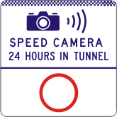 A road sign titled "G6-331-1n - Speed Camera 24 Hours In Tunnel" features a camera icon, radio waves, this text, and a large red circle beneath to indicate the speed limit.