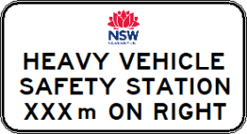Rectangular road sign G9-249-4n featuring the NSW Government logo; text below reads: "HEAVY VEHICLE SAFETY STATION __m ON RIGHT," where the blank is filled with the specified distance.