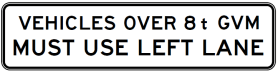 A rectangular sign (G9-250-4n) with black text on white reads: "VEHICLES OVER 8 t GVM MUST USE LEFT LANE.