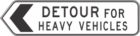 The G9-5-2(L) Detour For Heavy Vehicles (Left) sign is rectangular, featuring a large left arrow and "DETOUR FOR HEAVY VEHICLES" in black on a white background with a black border.