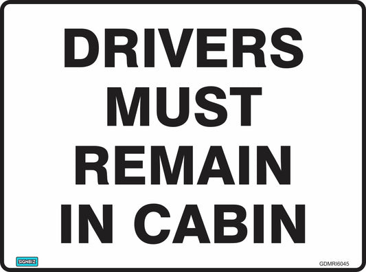 A rectangular sign with bold black text on a white background reads: "DRIVERS MUST REMAIN IN VEHICLE.