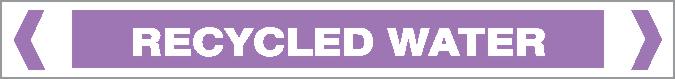The Pipe Marker - ACID / ALKALI - RECYCLED WATER features a rectangular design with a purple background, white border, bold uppercase "RECYCLED WATER" text, and two white chevrons on each side.