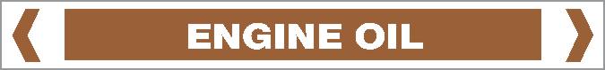 A rectangular brown "Pipe Marker - OILS - ENGINE OIL" sign features bold white capital letters for "ENGINE OIL," white borders, and angle brackets at each end.