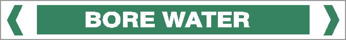 A rectangular green Pipe Marker labeled "BORE WATER" in white text, centered and bordered by white angled brackets, Product Name: Pipe Marker - WATER - BORE WATER.