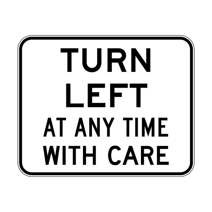 The R2-16n Turn Left At Any Time With Care is a rectangular NSW regulatory road sign featuring a white background, black border, and bold uppercase message: "TURN LEFT AT ANY TIME WITH CARE.