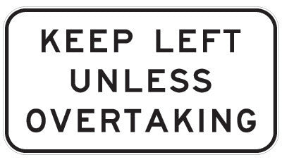 The R6-29 - Keep Left Unless Overtaking sign is a rectangular regulatory road sign with a black border and bold black text on white, compliant with Australian Standards and displaying "KEEP LEFT UNLESS OVERTAKING.