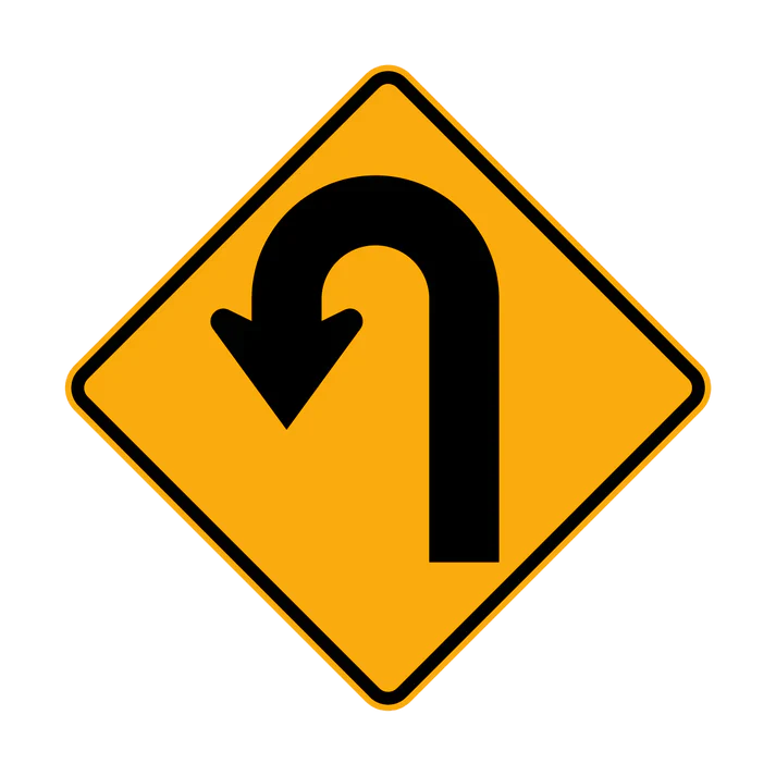 A yellow diamond-shaped W1-7(L) road sign with a thick black arrow curving sharply left, symbolizing a left hairpin bend ahead.