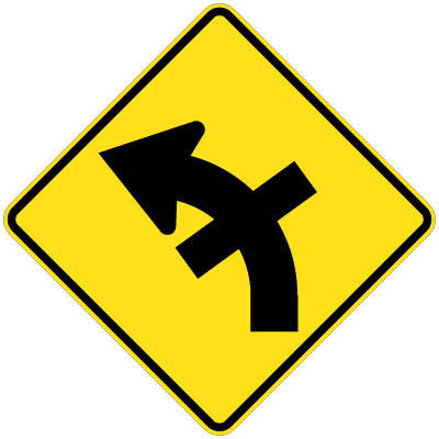 The W2-15(L) sign is a yellow diamond with a black left curve arrow and a side road symbol indicating a cross road enters from the right on the curve.