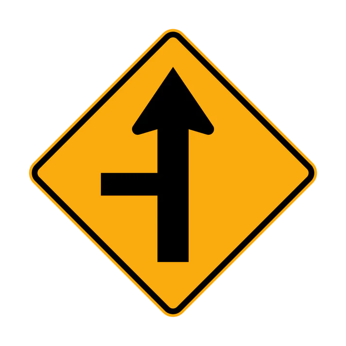 The W2-4(L) - Side Road Intersection on Straight (Left Symbolic) sign is a yellow diamond with a black arrow pointing straight and a perpendicular line joining from the left, indicating a side road enters from the left ahead.