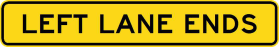 A rectangular yellow W4-9-1n(L) road sign for tunnel use only, with a black border and black text reading "LEFT LANE ENDS.