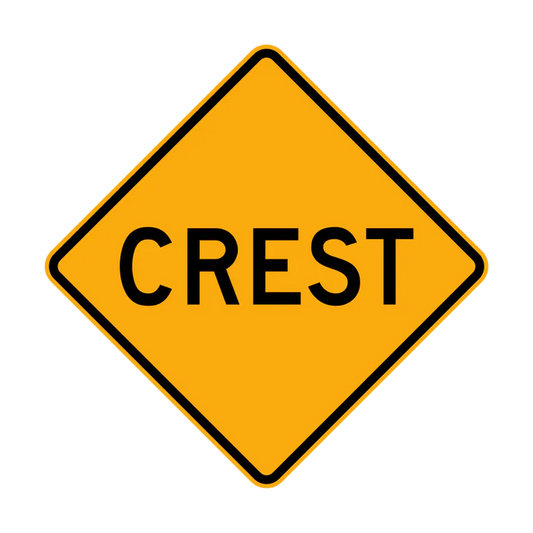 The W5-11 - Crest is a yellow diamond-shaped road sign featuring the word "CREST" in bold black letters, warning drivers of a hillcrest or the top of a hill ahead.