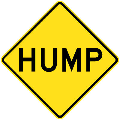 The W5-222n - Hump is a yellow, diamond-shaped road sign with "HUMP" in bold black letters, warning drivers of a raised section or bump ahead.