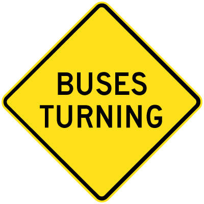 The W5-232n - Buses Turning is a yellow diamond-shaped road sign with black text that reads "BUSES TURNING.