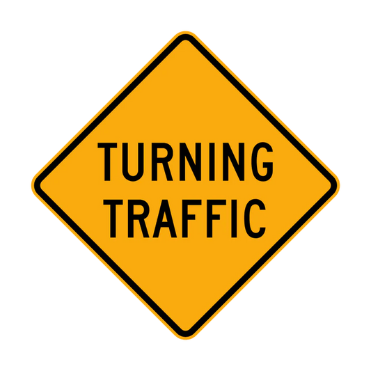 The W5-25n - Turning Traffic sign is a yellow diamond-shaped road sign with a black border and bold black "TURNING TRAFFIC" text, warning drivers about vehicles turning ahead.