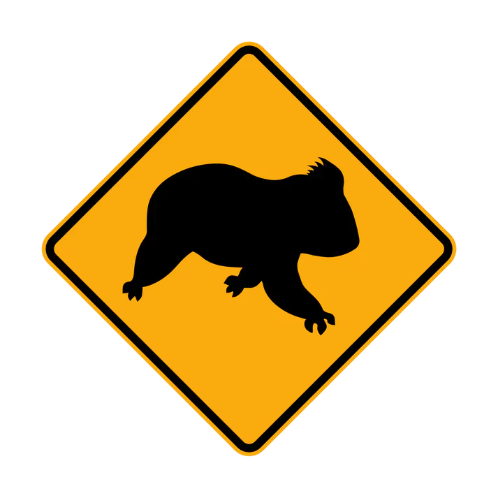 A yellow diamond-shaped road sign with a black silhouette of a koala in the center, indicating a W5-47 - Koala (Symbolic) crossing area.