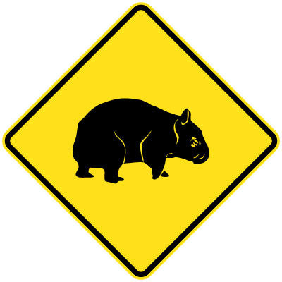 The W5-48 - Wombat (Symbolic) is a yellow diamond-shaped road sign featuring a black silhouette of a wombat centered and outlined in black.