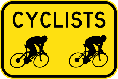 The W6-213n - Beware Cyclists (Symbolic) sign is yellow with two black cyclist silhouettes and the word "CYCLISTS" in large black letters.
