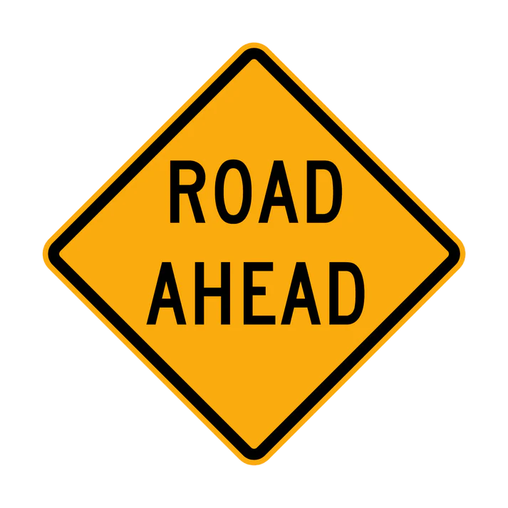 The W6-8 - Road Ahead sign is a yellow diamond-shaped road sign featuring the words "ROAD AHEAD" in bold black capital letters.