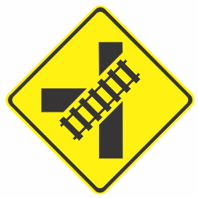 The W7-12-1n(L) sign is a yellow diamond with a black symbol illustrating an oblique railway crossing at a T-junction (left shown), used to warn drivers of the upcoming diagrammatic railway crossing ahead.
