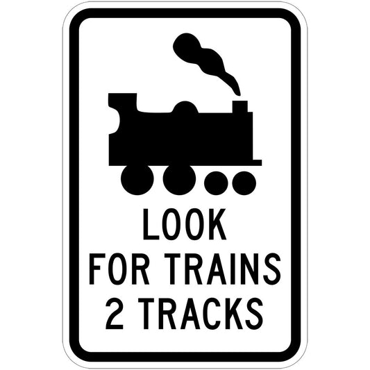 The W7-14-4 sign features a train symbol above "LOOK FOR TRAINS 2 TRACKS," warning pedestrians to watch for trains at a two-track railway crossing.