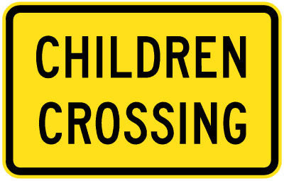 A W8-221n Children Crossing sign is rectangular, yellow, and features black text reading "CHILDREN CROSSING.