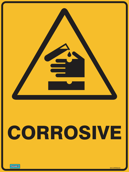 The Warning Corrosive sign features a yellow background and a black pictogram of a test tube pouring liquid onto a hand, causing damage. "CORROSIVE" appears in bold beneath the image, emphasizing this essential hazard warning.