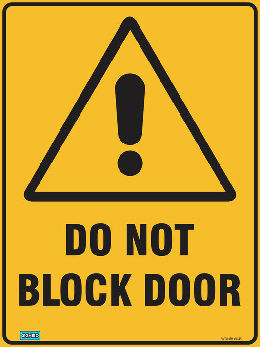 The "Warning Do Not Block Door" sign features a yellow triangle with a black exclamation mark above bold black text, providing a clear safety warning to keep doors unobstructed.
