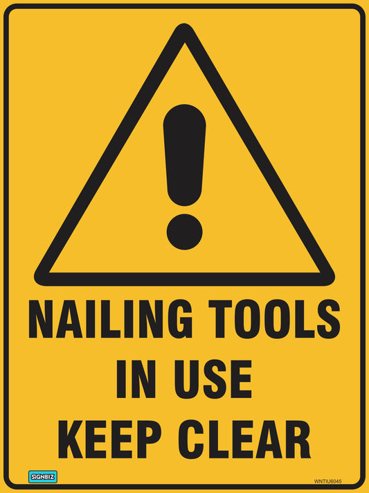 The Warning Nailing Tools In Use sign is a yellow AS/NZ 1319-1994 safety sign with a black exclamation mark in a triangle and "NAILING TOOLS IN USE KEEP CLEAR" in bold black letters, meeting standard warning requirements.